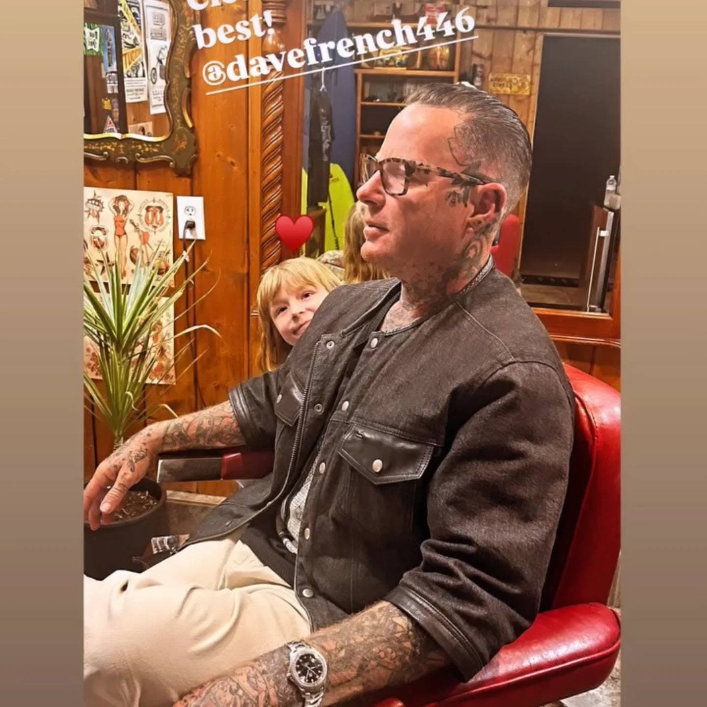 Client in the red barber chair mid-cut