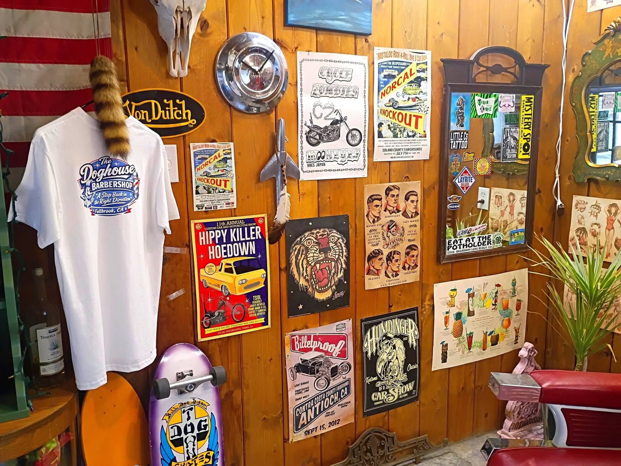 Knotty pine wall with vintage motorcycle signs and posters