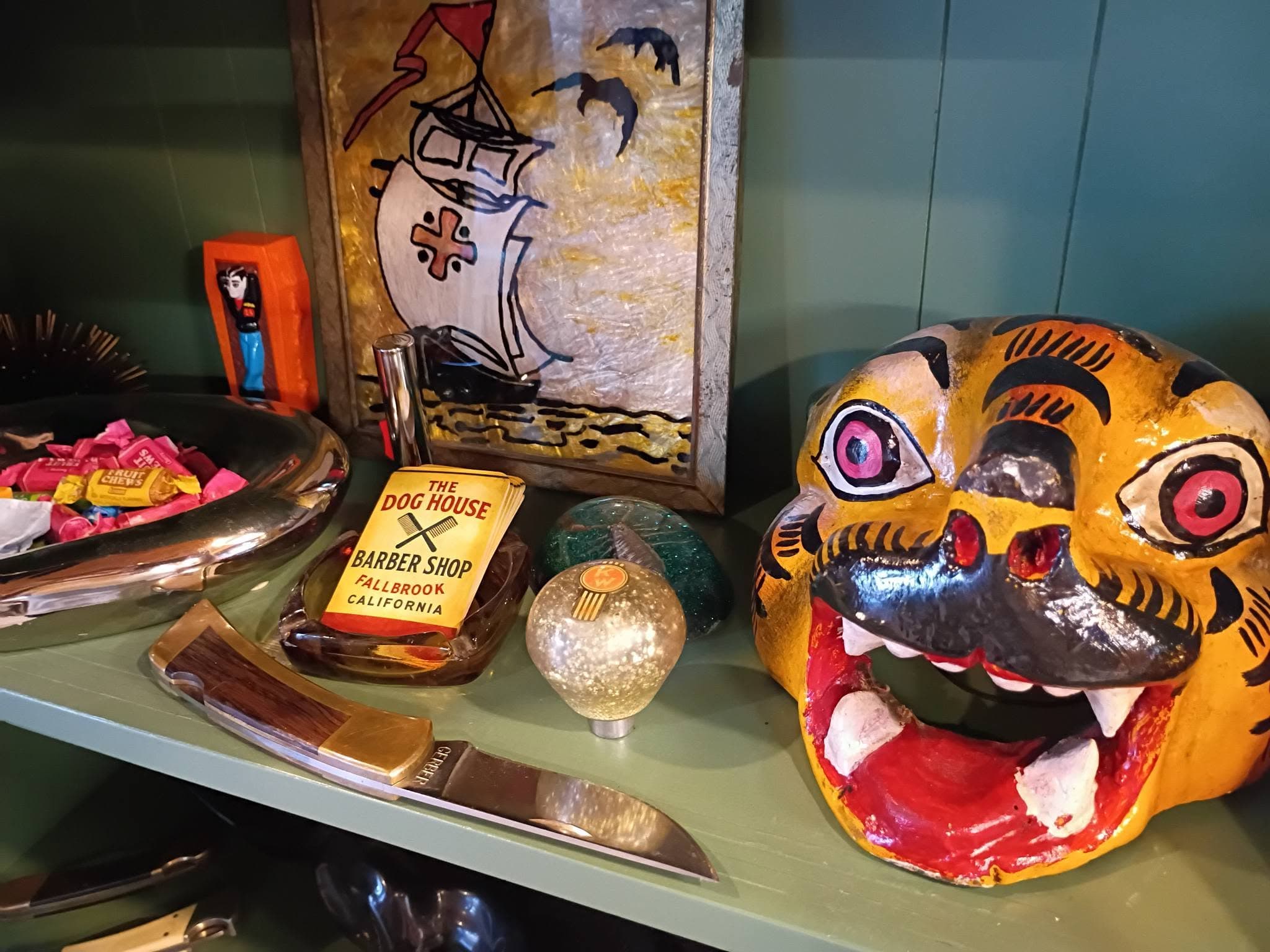 Display shelf with tiger figurine and metal trays